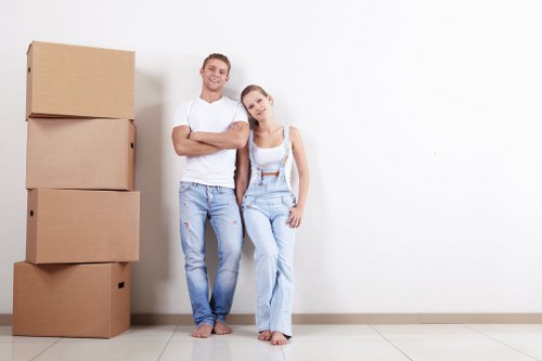 Removal van and moving team in an Arkley residential street