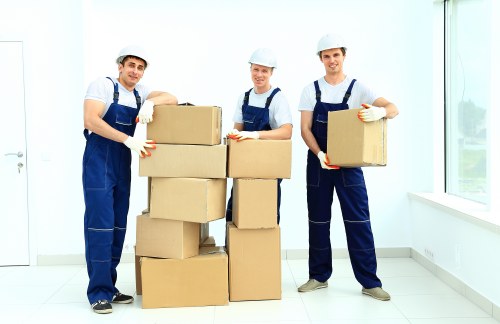 Loading furniture into a moving truck in Arkley