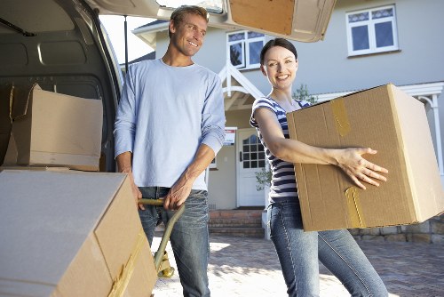 Commercial relocation team transporting office furniture in Arkley